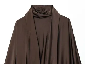 Close up of dark brown satin scarf collar long sleeve dress detail highlighting fabric texture.