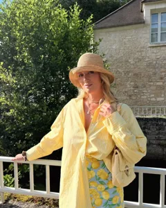 Detailed shot of a stylish yellow striped loose casual shirt, perfect for summer sun protection.