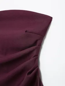 Close-up of women's purple strapless tube top featuring elegant ruching and dart detail.
