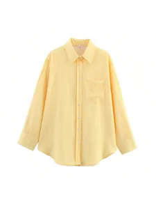 Detailed view of women casual yellow and white striped long sleeve shirt button up design.