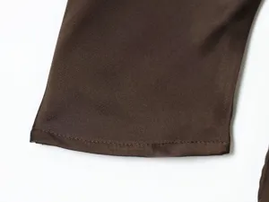 Silk satin dress cuff detail showing smooth texture and neat stitching for elegant women's wear