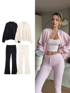 Ensemble de sport décontracté en deux pièces avec veste bomber zippée et pantalon évasé.