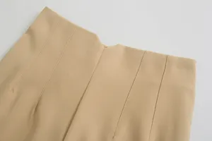 High waist casual trousers detail view showing neat stitching and premium beige fabric texture.