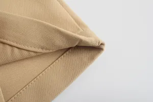 Detailed view of khaki casual pants fabric, fine stitching and durable texture design.