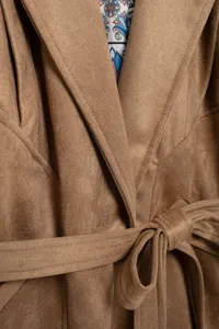 Close-up view of the brown faux suede women jacket lapel and belt texture design.
