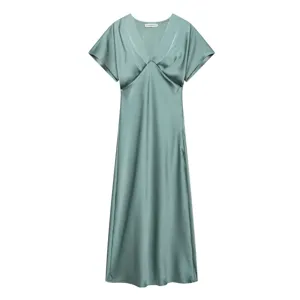 Detailed view of the elegant sage green satin V-neck midi dress with short sleeves.
