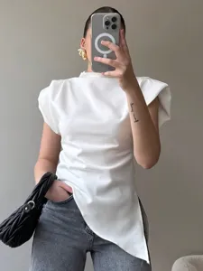 European style white asymmetric shoulder pad top with pleats for women spring fashion.