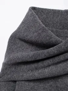 Close-up detail of dark grey knit fabric collar for women short knit coat, soft and warm.