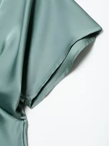 Silk satin dress sleeve detail, smooth fabric texture, elegant aesthetic fashion clothing close up.