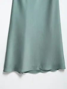 Silk satin dress fabric detail shot, elegant drape and smooth shiny surface for women.