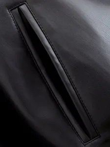 Close-up detail of black leather jacket pocket with fine stitching and smooth texture.