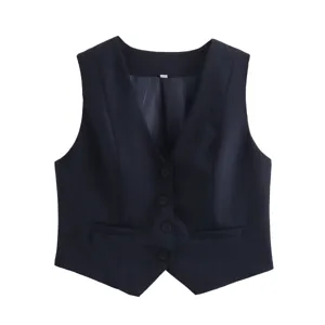 Close-up detail of the dark blue V-neck vest, featuring elegant buttons and fine tailoring.