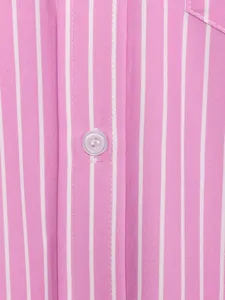 Pink and white striped shirt fabric detail showing button placket and fine sewing craftsmanship.