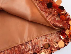 Detailed close-up view showing the smooth inner lining and shiny sequin skirt fabric texture.
