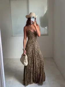 Detailed view of the chic leopard print camisole long dress with a classic V-neck style.
