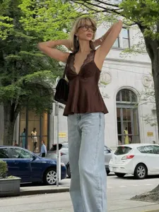 Satin lace camisole top detail, V-neck sleeveless design, elegant brown fabric style.