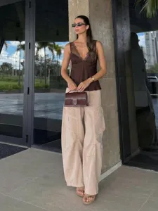 Detailed view of the stylish brown lace satin camisole top paired with casual cargo pants.