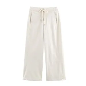 Close-up view of casual wide-leg pants featuring a soft drawstring waist and neat side seams.