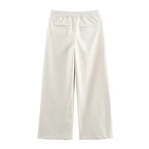 Back detail of elegant off-white wide leg pants with elastic waist and stylish pockets.
