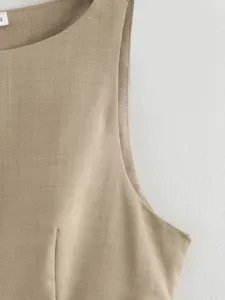 Beige sleeveless top detail shot, showing premium fabric texture and fine stitching craftsmanship.