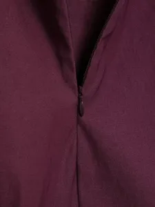 Detailed view of women's top wine red fabric zipper closure texture quality apparel.