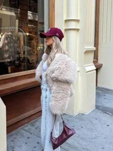 Detailed shot of the chic oversized faux fur lapel coat, showcasing soft texture and stylish fit.