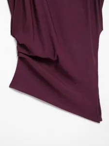 Close-up view of the elegant purple asymmetric draped top showcasing fine pleated fabric.