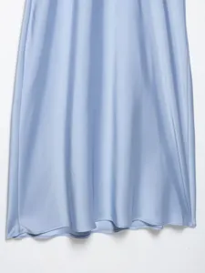 Light blue satin dress detail view, smooth silk texture fabric drape showing elegance.