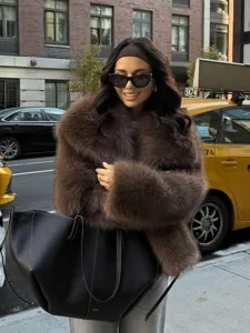 Brown faux fur lapel coat for women, warm winter fashion loose streetwear outerwear style.
