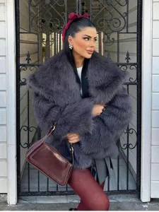 Close-up detail of luxurious dark grey faux fur lapel coat paired with chic burgundy accessories.