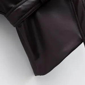Close-up detail of women's fashion autumn short leather jacket belt loop texture view