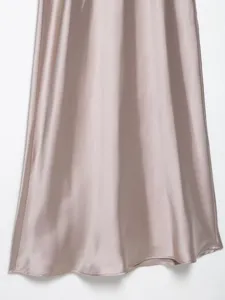 Satin dress fabric detail closeup, smooth drape texture, elegant champagne tone surface.