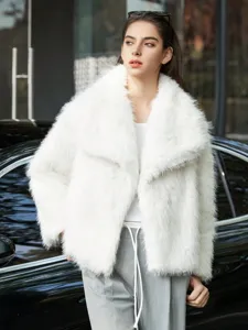 Detail view of women loose faux fur lapel coat winter warm fluffy outerwear fashion style.