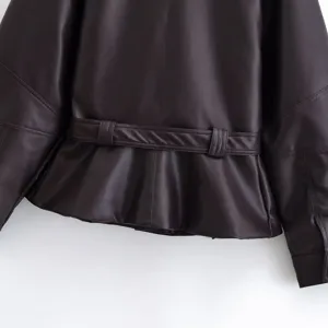 Close up view of women faux leather short jacket back design with stylish belt peplum hem.