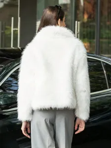 Detailed view of women's white faux fur lapel jacket, loose fit and stylish winter outerwear.