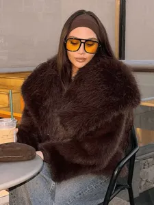 Detailed view of women fashion loose brown faux fur lapel coat winter warm street style jacket.