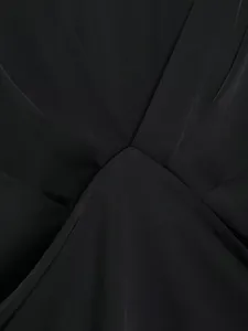Black satin dress fabric detail, elegant V-neck overlap design, premium smooth textile texture.