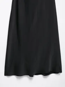 Black satin dress detail, elegant smooth silk texture, minimalist style fabric close up view.