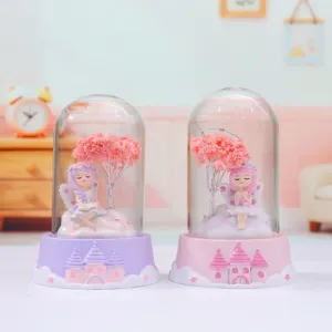 Detailed view of cute fairy glass dome night light desktop ornament with pink castle base for bedroom decor.