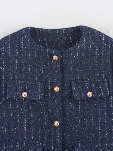 Navy blue tweed cropped jacket detailed shot, featuring round neck, gold buttons and pockets.