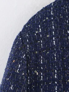 Navy blue tweed fabric detail with gold threads and sequins for stylish women jacket.