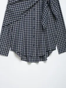 Detailed view of women's French plaid long sleeve shirt featuring a stylish tied collar detail.