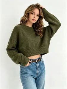 Detailed view of this olive green knit sweater, showcasing its soft texture and cozy cropped fit.