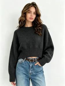 Detailed close-up view of women's dark grey knitted sweater, soft relaxed fit casual style.