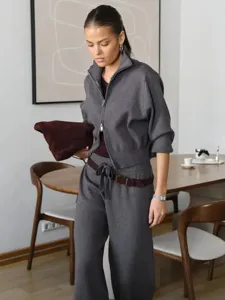 Grey knitted zip-up sweater and wide-leg pants two-piece set, elegant casual outfit.