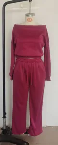 Detail view of casual off-shoulder top and wide leg pants set, solid color knitwear outfit.