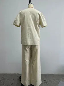 Detailed back view of the casual beige short sleeve top and long pants set for women.