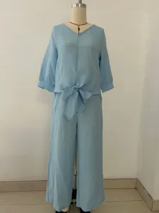 Detailed view of the light blue V-neck tie-front top and matching trousers set.