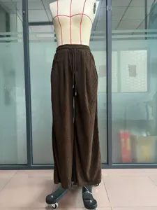 Brown corduroy wide leg pants detail, high waist casual drawstring trousers, comfortable fit.