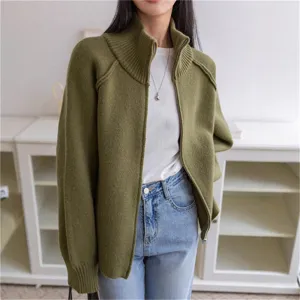 Olive green knit cardigan detail, soft texture and metal zipper design closeup view.